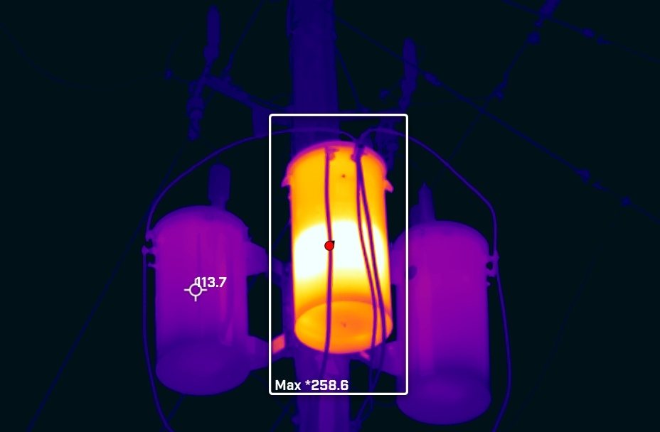Infrared image of an overheating utility pole transformer